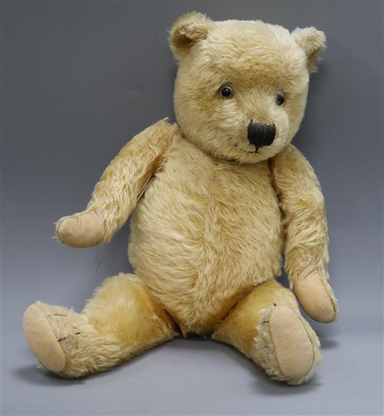 A 1903s Chiltern teddy bear, Joe, with golden mohair, large clear and black glass eyes, pronounced snout,